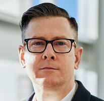 Alexander Hughes, CEO di perusahaan trading kripto, potret.